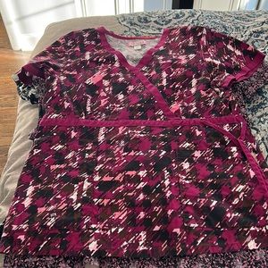 Purple scrub top with drawstring waist and two pockets